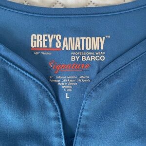 Grey’s Anatomy royal blue scrubs.